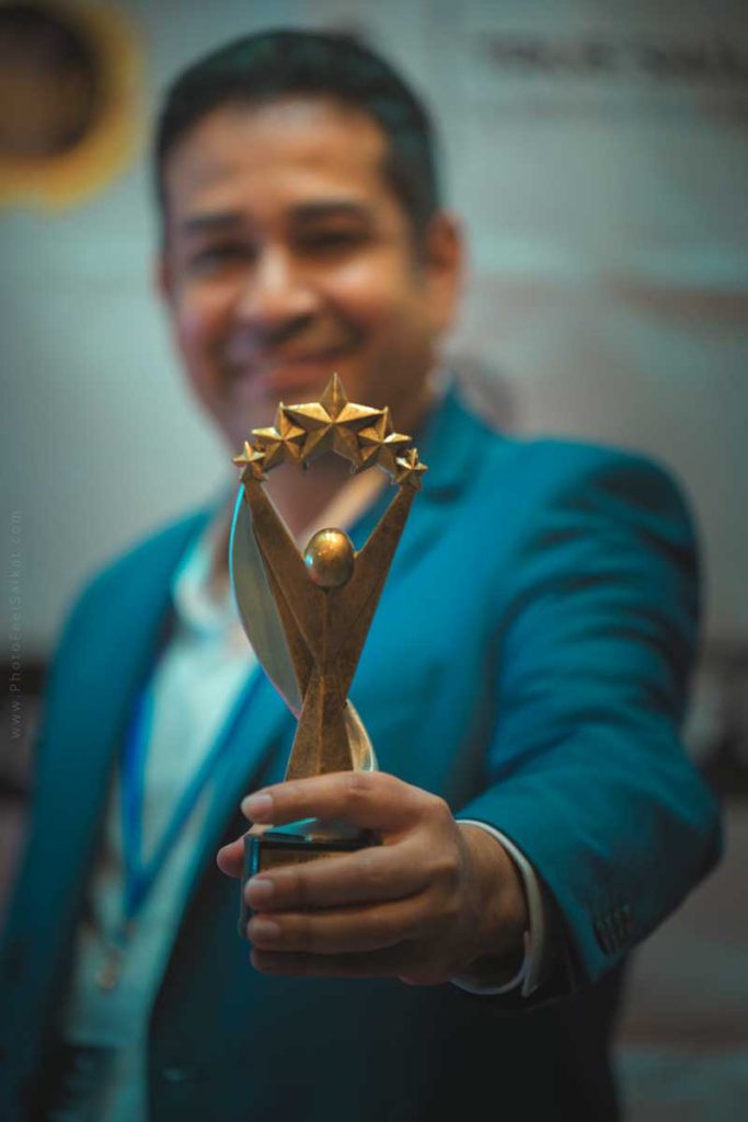 Director Edgar Garcia Chavez holds an award he received at the International Black & Diversity Film Festival