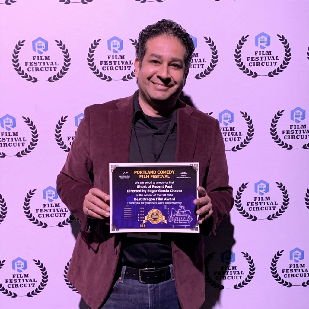 Director Edgar Garcia Chavez accepting the Best Oregon Film award from the Portland Comedy Film Festival.